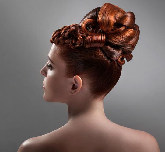 Glamorous oversize updo with woven effects